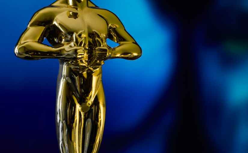 academy award in front of blue alien character