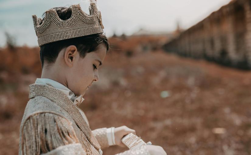 boy wearing a prince costume