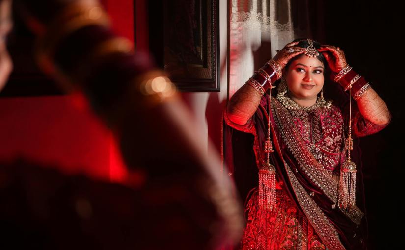 elegant indian bride in traditional red attire