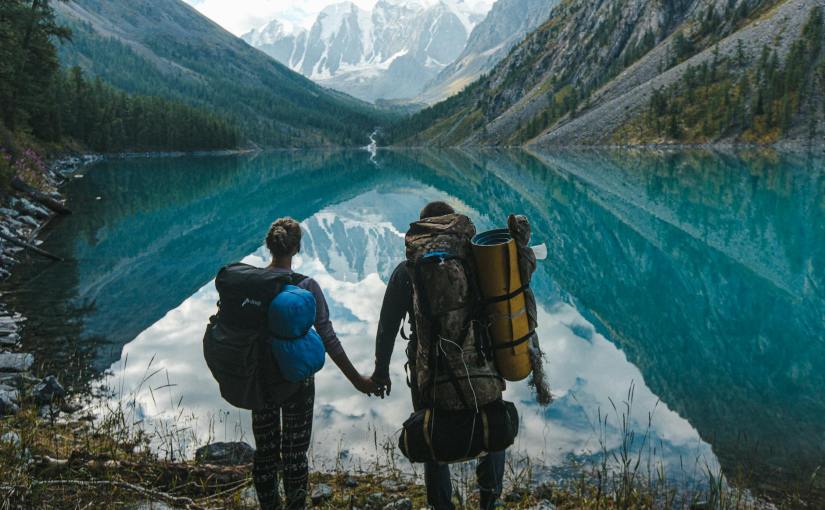 couple standing near lake